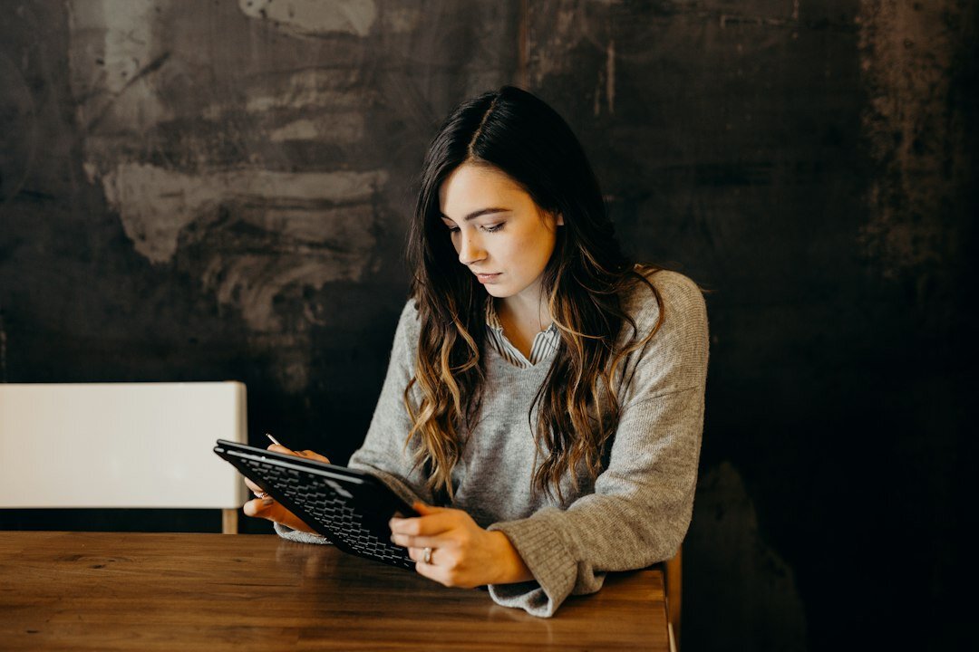 person reading news on tablet