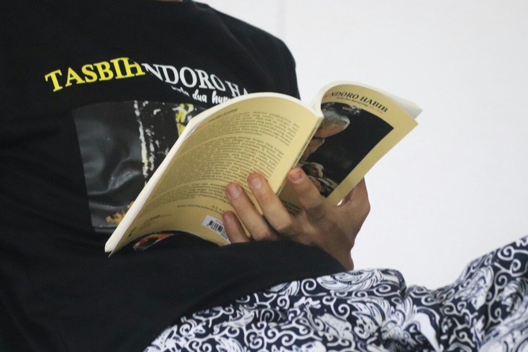 person reading magazine about celebrities
